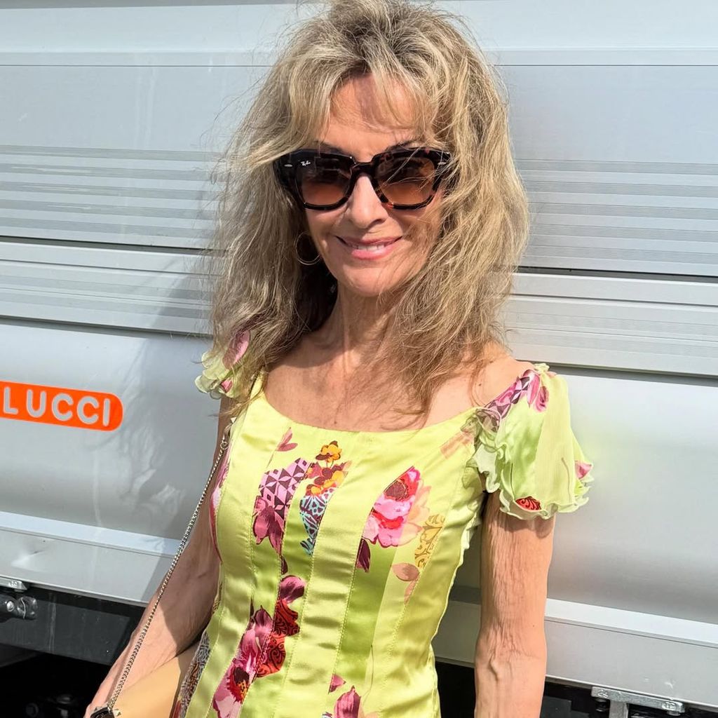 Susan posing with blonde natural hair