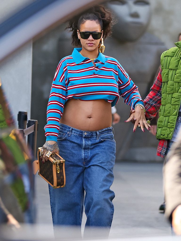 Rihanna pregnant in a striped crop top