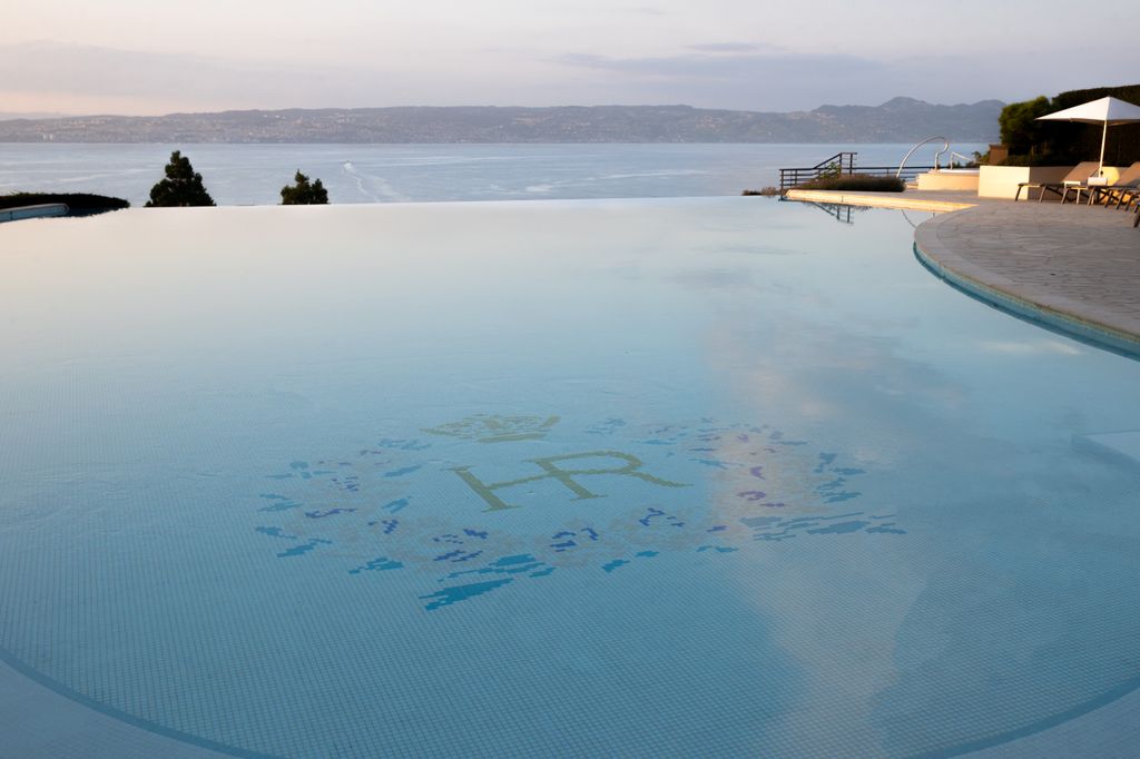 The outdoor pool has stunning views of Lake Geneva