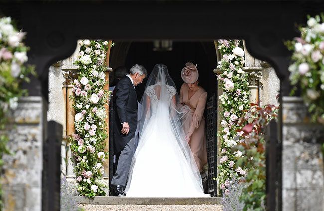 Kate Middleton adjusts Pippa Middletons wedding dress in May 2017