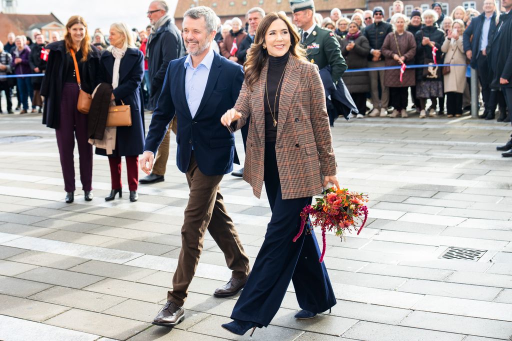 King Frederik and Queen Mary of Denmark in check blazer on walkabout