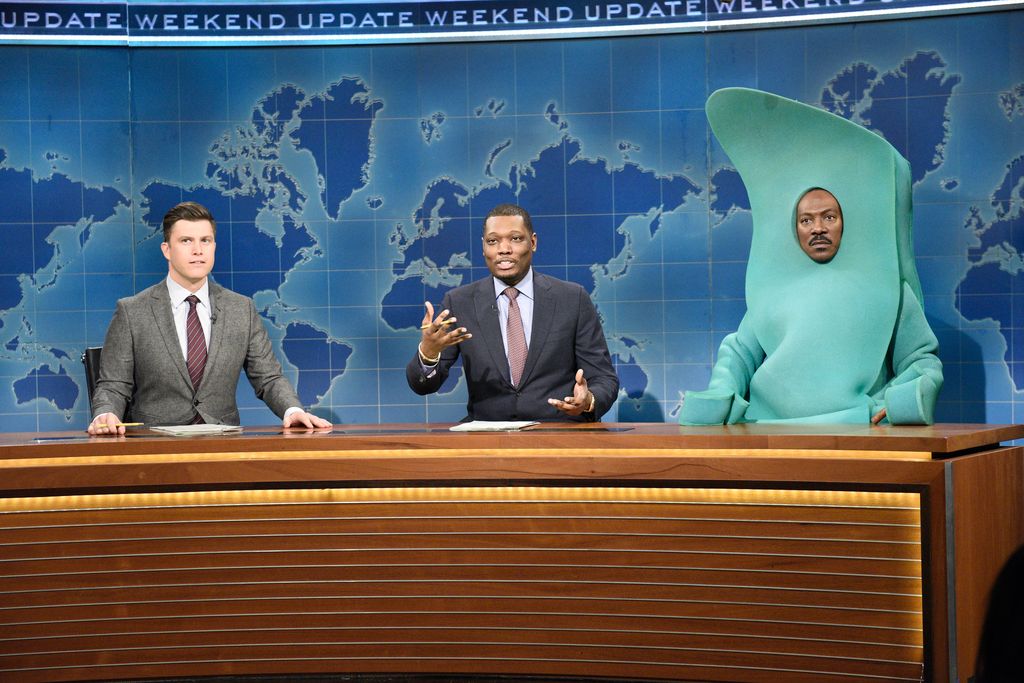 Colin Jost, Michael Che, and host Eddie Murphy as Gumby during Weekend Update on Saturday Night Live on December 21, 2019