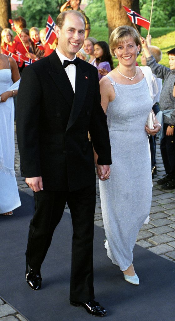 sophie and edward holding hands in formal dress