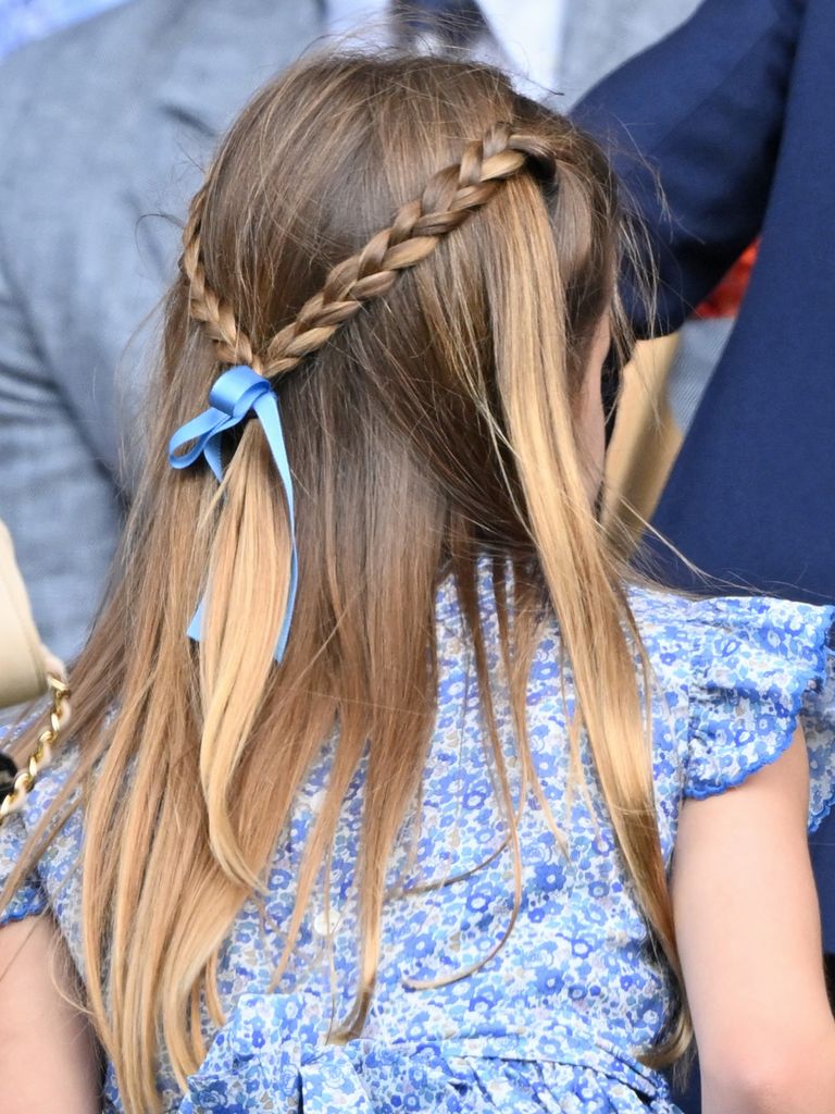 Princess Charlotte with a blue bow in her hair at Wimbledon