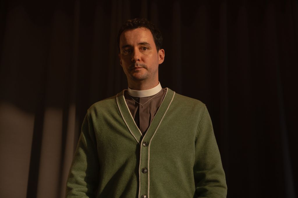 Sam Swainsbury as Father Douglas Carrisford in The Red King
