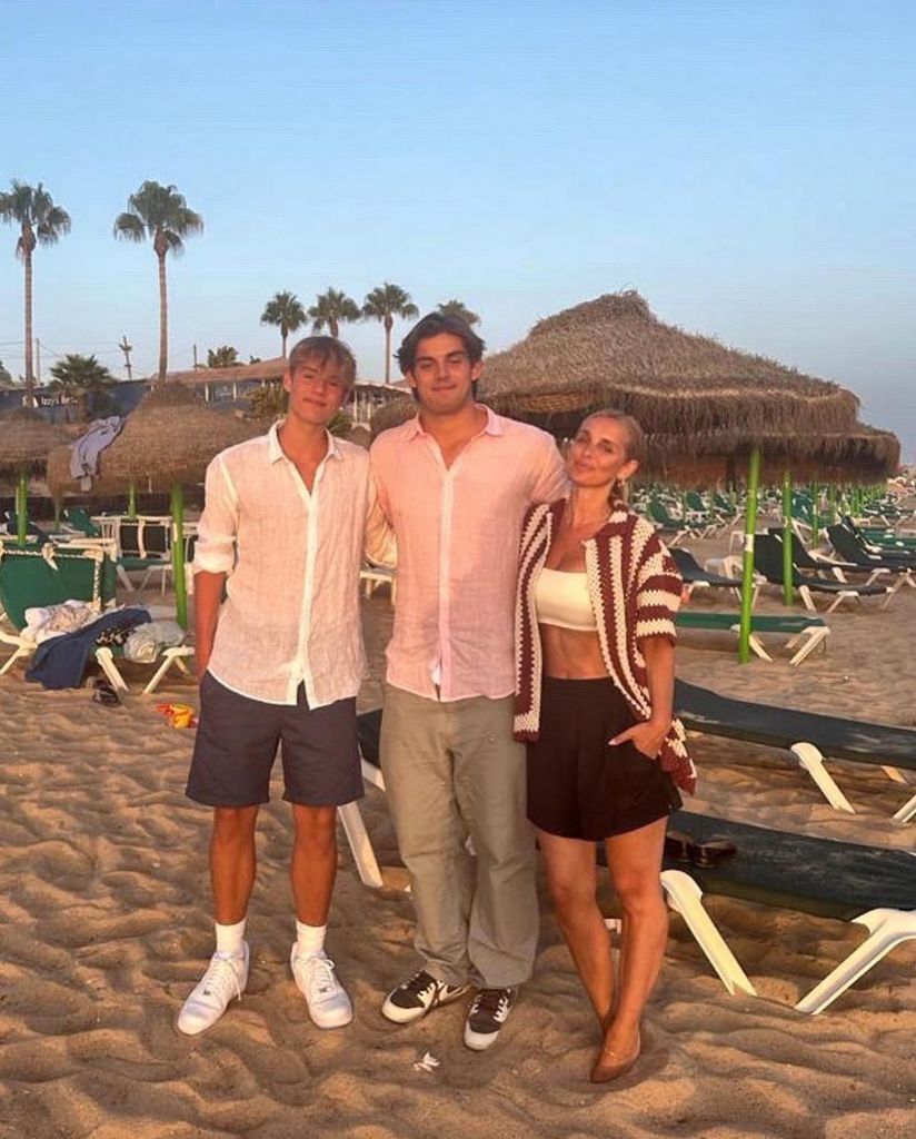 mother at beach with two sons