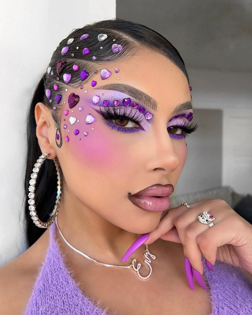 Woman with heart rhinestones makeup