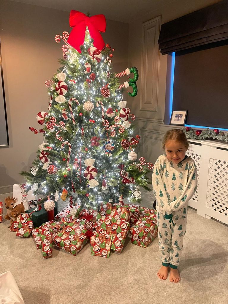 Ella Jordan by the Christmas tree