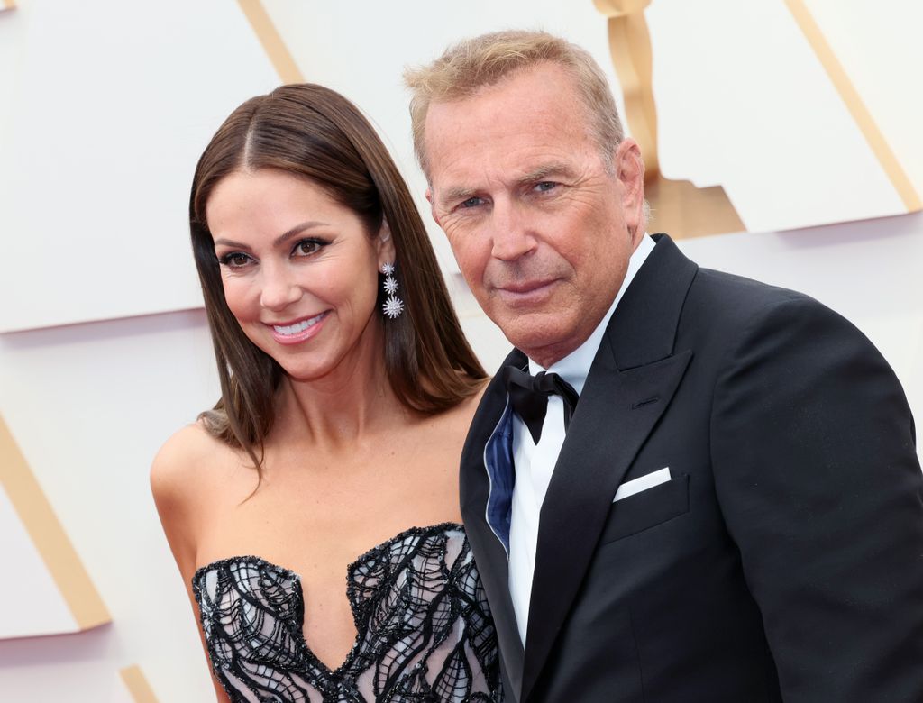 HOLLYWOOD, CALIFORNIA - MARCH 27: Christine Baumgartner and Kevin Costner attend the 94th Annual Academy Awards at Hollywood and Highland on March 27, 2022 in Hollywood, California. (Photo by David Livingston/Getty Images)