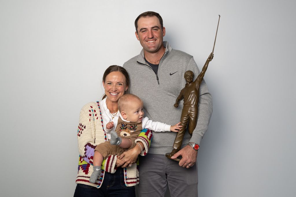 Scottie Scheffler, his wife, Meredith Scheffler, and their baby son, Bennett, pose together with the Jack Nicklaus Award for Player of the Year, on December 10, 2024 in Plano, Texas.