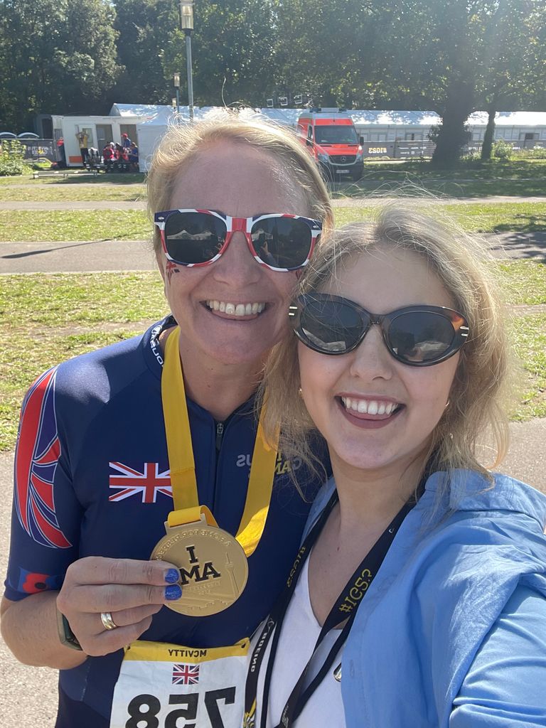 Isabelle Casey and Invictus medallist smiling and wearing sunglasses