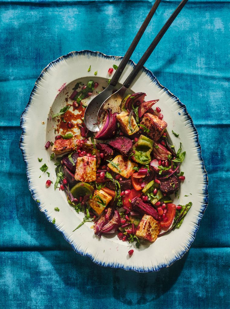 A bowl filled with colourful sweet potatoes and beetroot