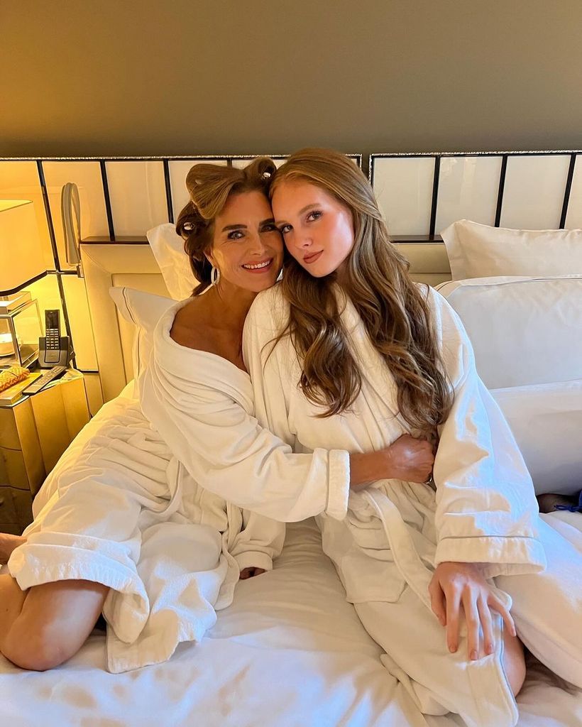 Brooke Shields with her teenage daughter Grier in a bed wwaring robes
