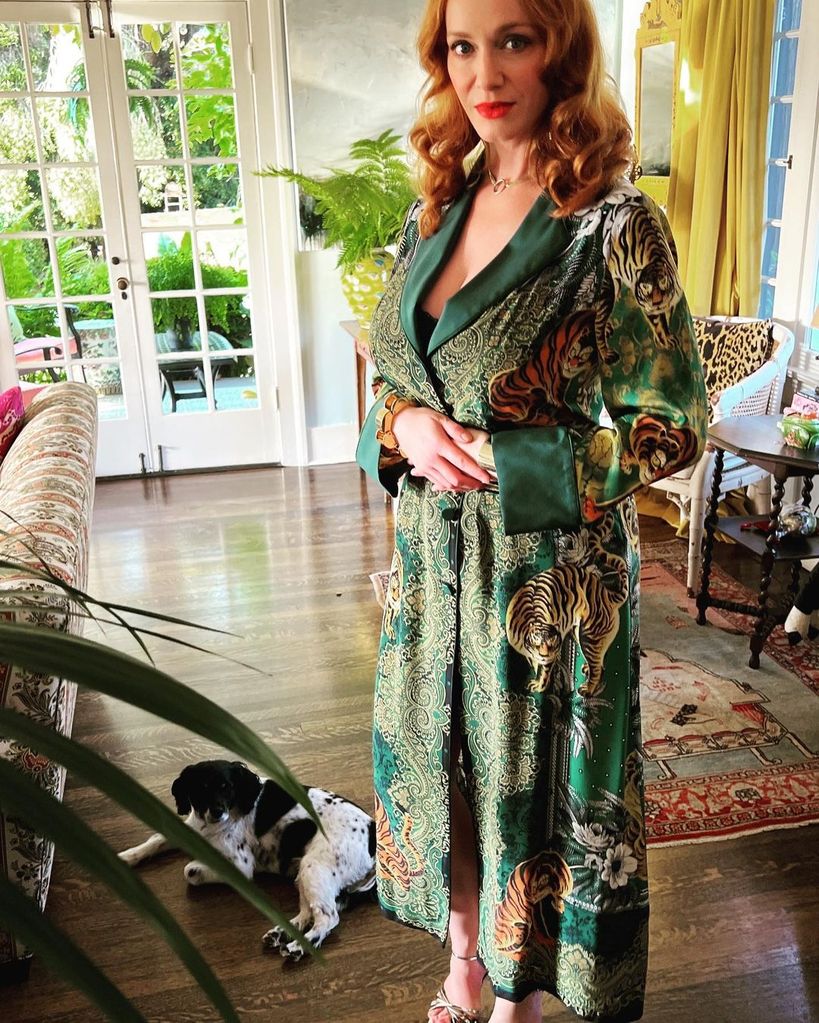 christina hendricks inside la home posing in animal motif dress