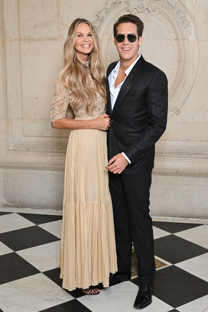 Elle Macpherson and son Flynn Busson attend the Christian Dior Haute Couture Fall Winter 2022 2023 show as part of Paris Fashion Week on July 04, 2022 in Paris, France