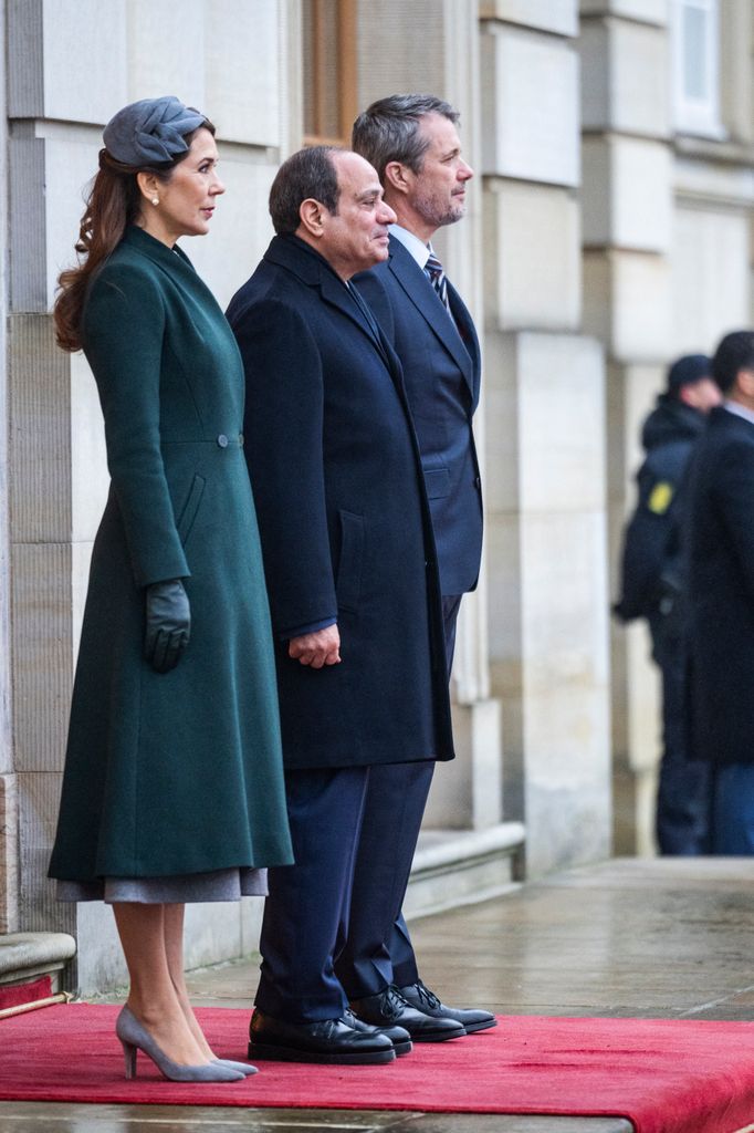 Queen Mary of Denmark, Egypt's President Abdel Fattah al-Sisi and King Frederik stand to attention