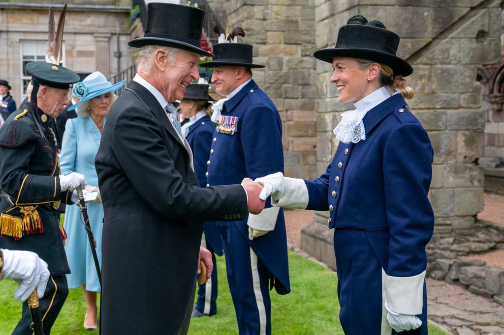  King Charles III meets Victoria Webber, one of the first female High Constables during the Sovereign's Garden Party held at the Palace of Holyroodhouse 