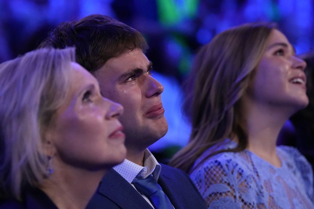 Gus gets emotional as he watches his father take the stage