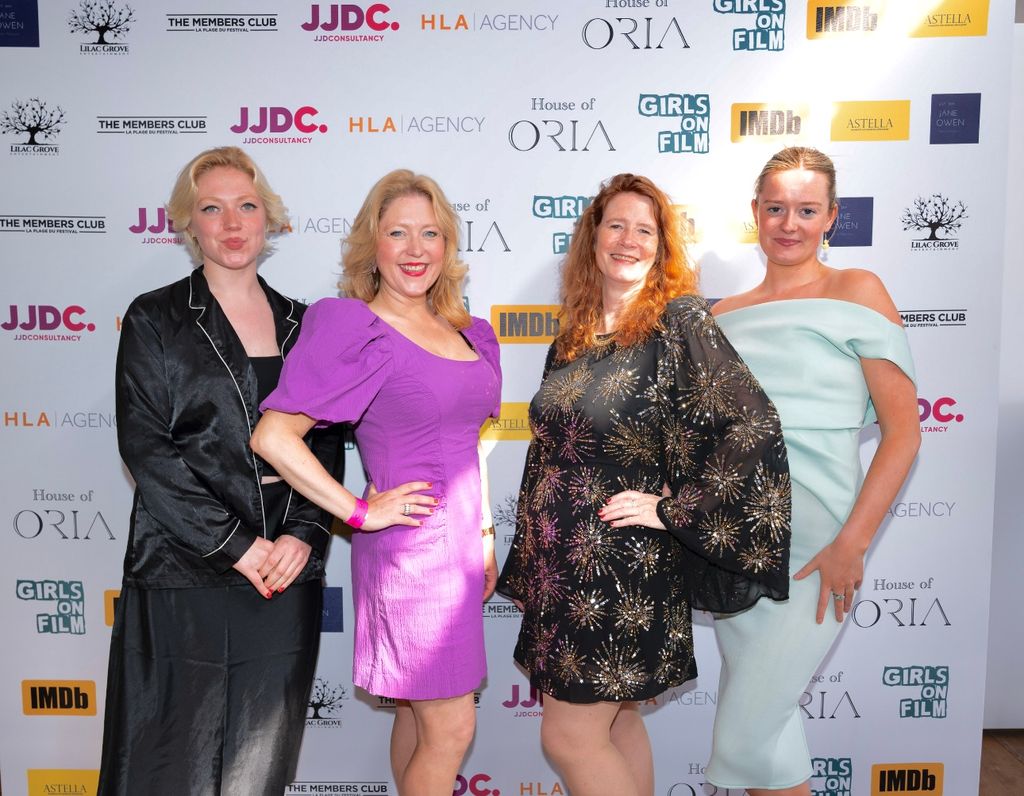 A photo of four women wearig evening gowns