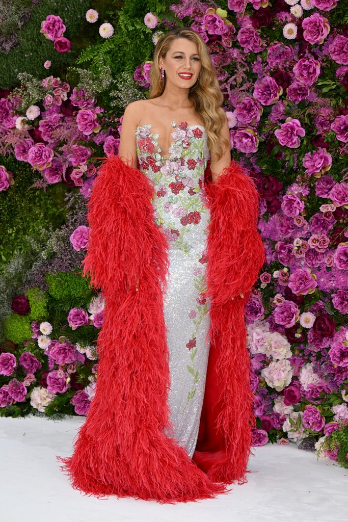 Blake Lively in sparkly gown with red feather jacket