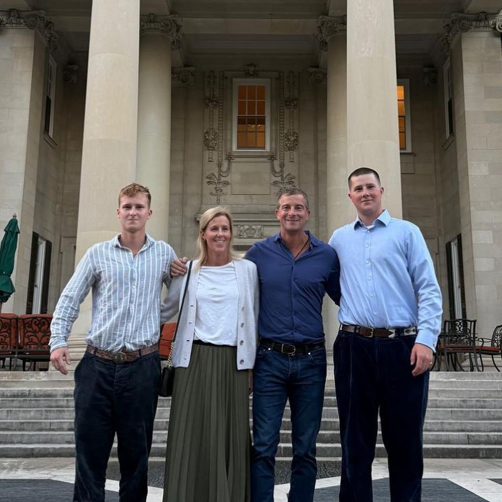 family of four posing for photo 