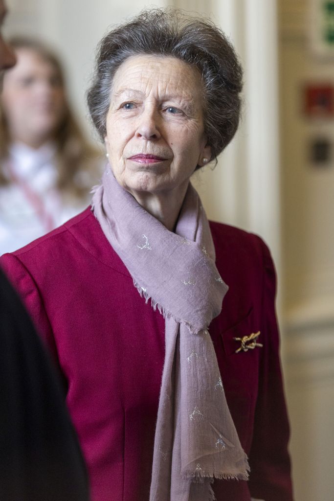 Princess Anne in burgundy jacket and scarf