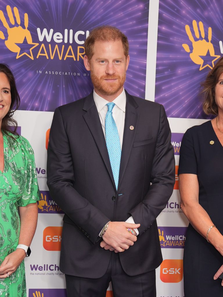 Prince Harry dark suit and blue tie