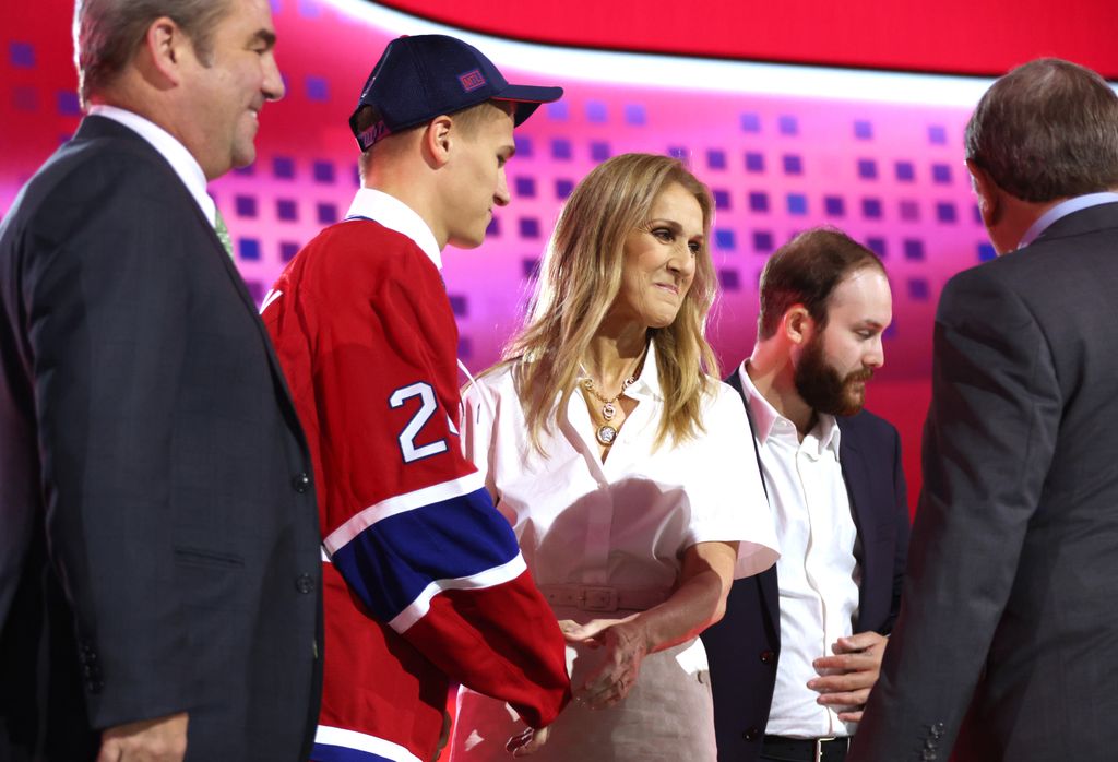 Ivan Demidov shakes hands with Celine Dion on onstage after being selected fifth overall by the Montreal Canadiens