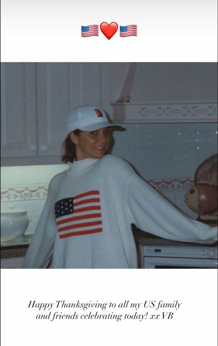 victoria beckham smiling in kitchen in white US flag jumper 