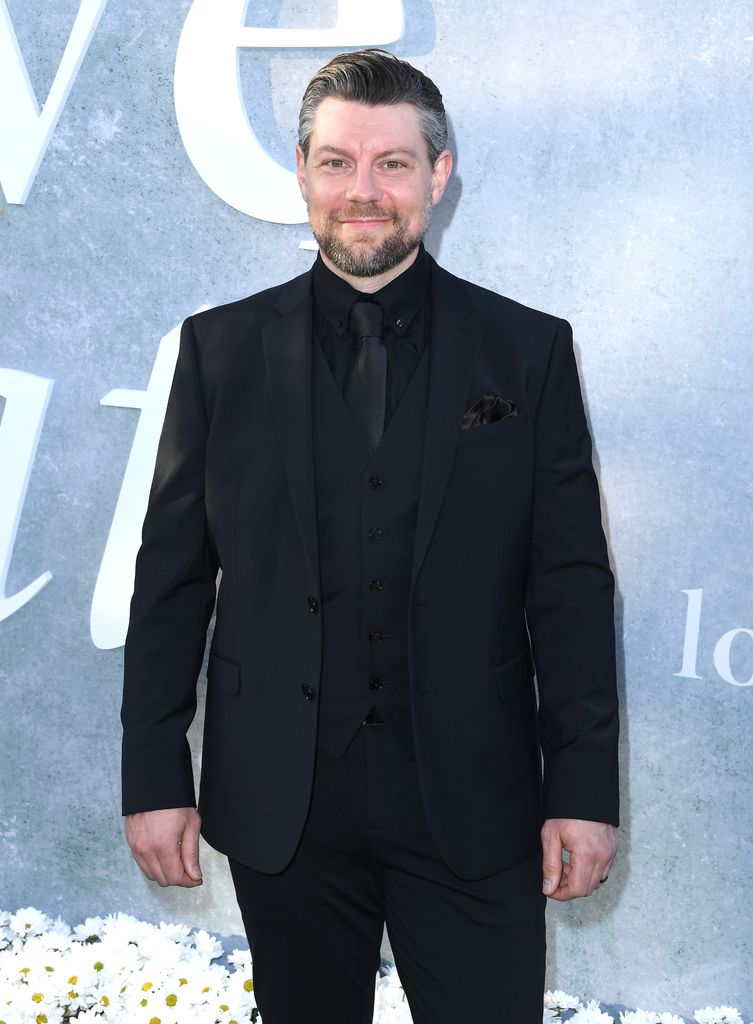 Patrick Fugit in a black suit