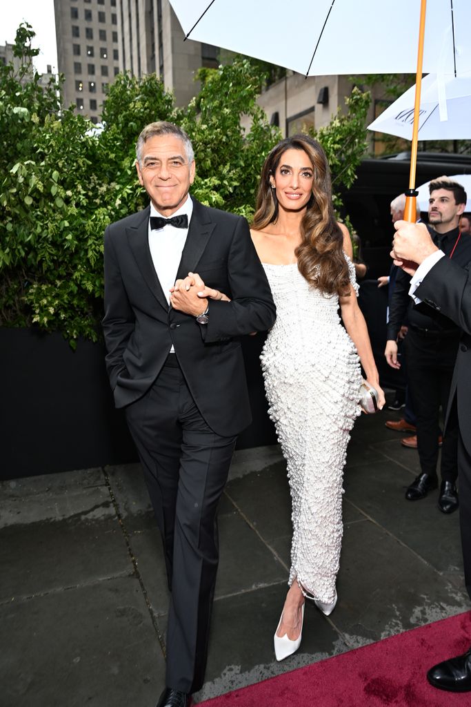 George Clooney and Amal Clooney arm in arm as they attend tony awards and walk the red carpet