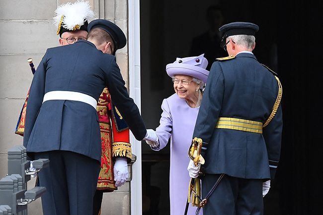 the queen shaking hands parade