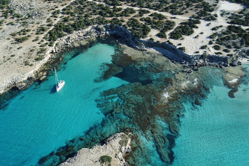 aerial view of boat in blue lagoon 