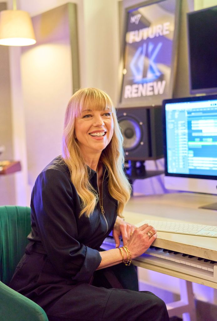 Sara Cox wearing a navy jumpsuit