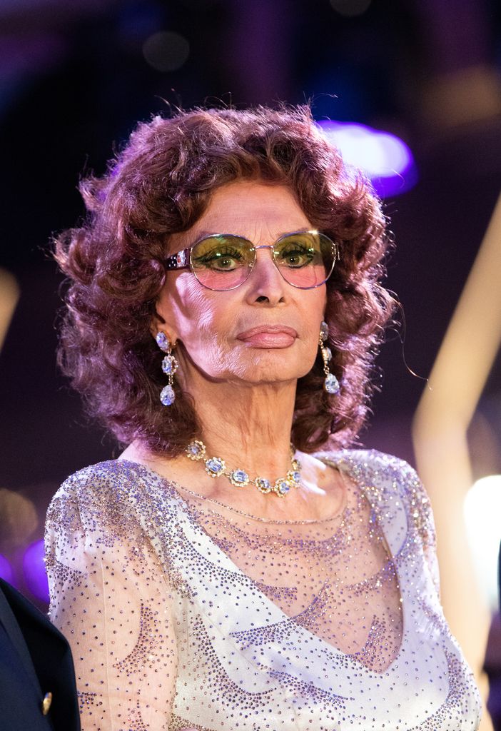 Sophia Loren in sparkly dress and tinted glasses