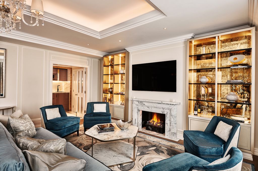 Landmark London's Signature Suites lounge with blue and bronze accents on a soft, tonal colour palette 