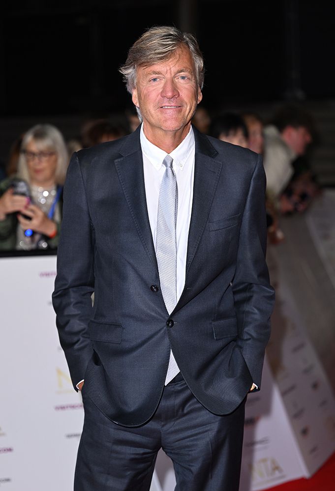 Richard Madeley on the red carpet in a navy suit