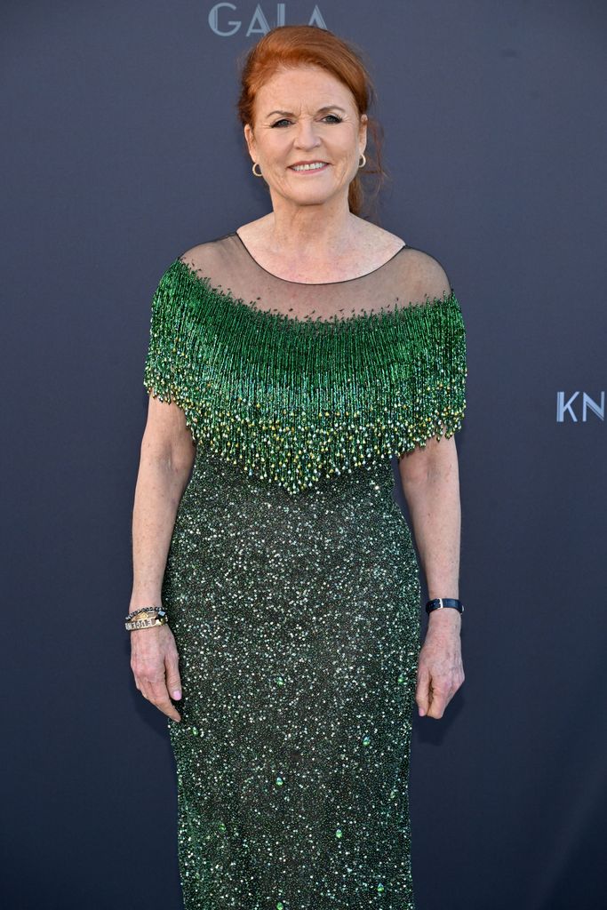 Sarah Ferguson smiling in glitzy green dress