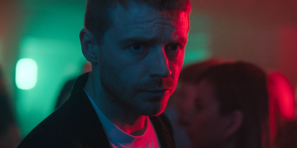 close-up of man in dimly lit room