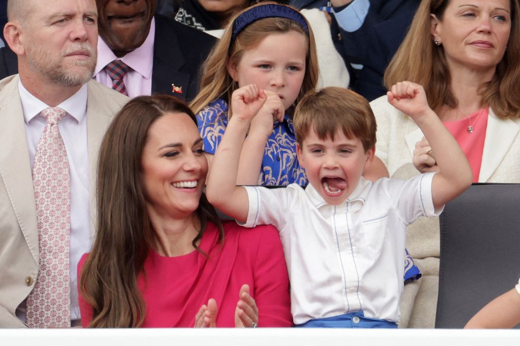 Kate laughing at louis with hands in air