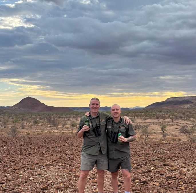 Iolo Williams and his son Dewi in the savannah