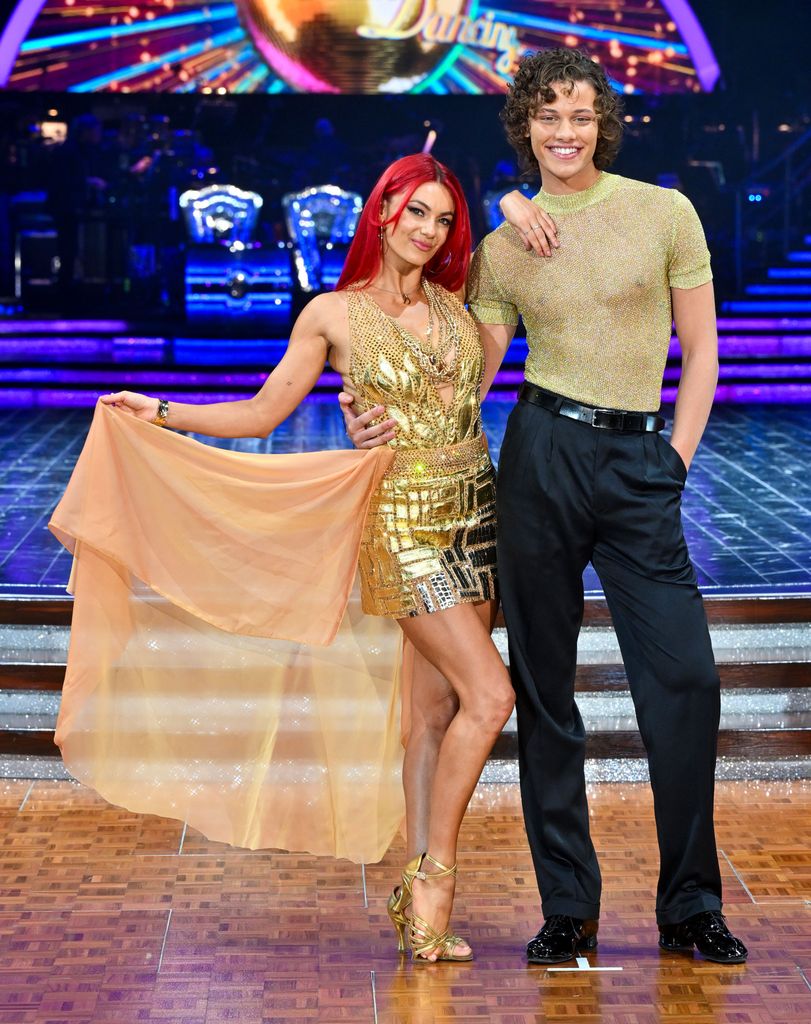 Dianne Buswell in a bronze dress and Bobby Brazier in a sheer shirt and trousers