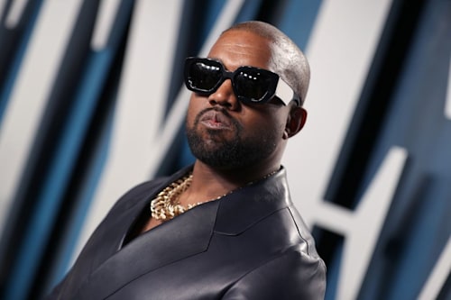 Ye wearing black leather jacket and sunglasses