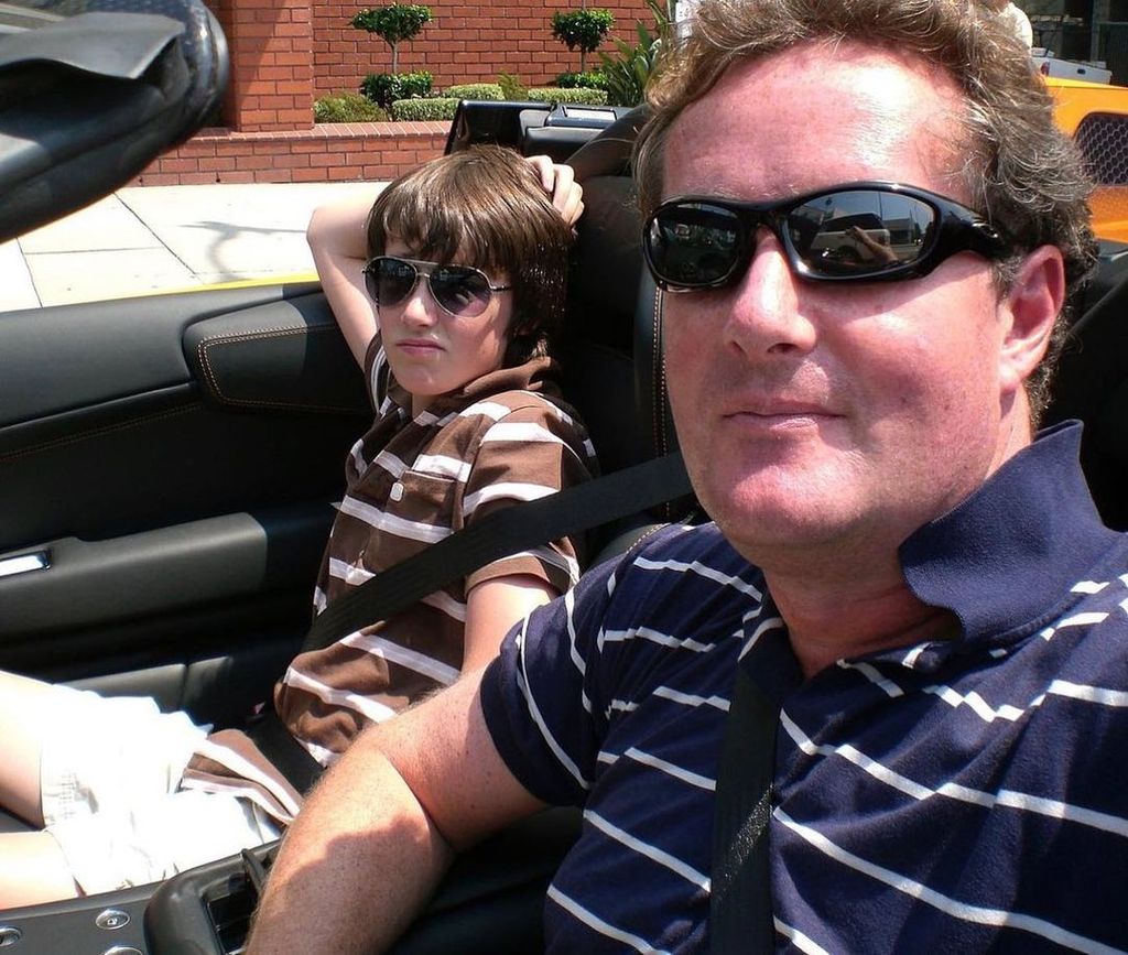 Piers Morgan wearing sunglassses in a car with his son Spencer