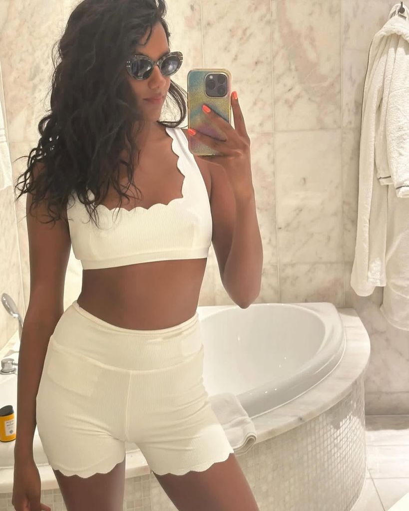simone ashley in white shorts and bralette selfie