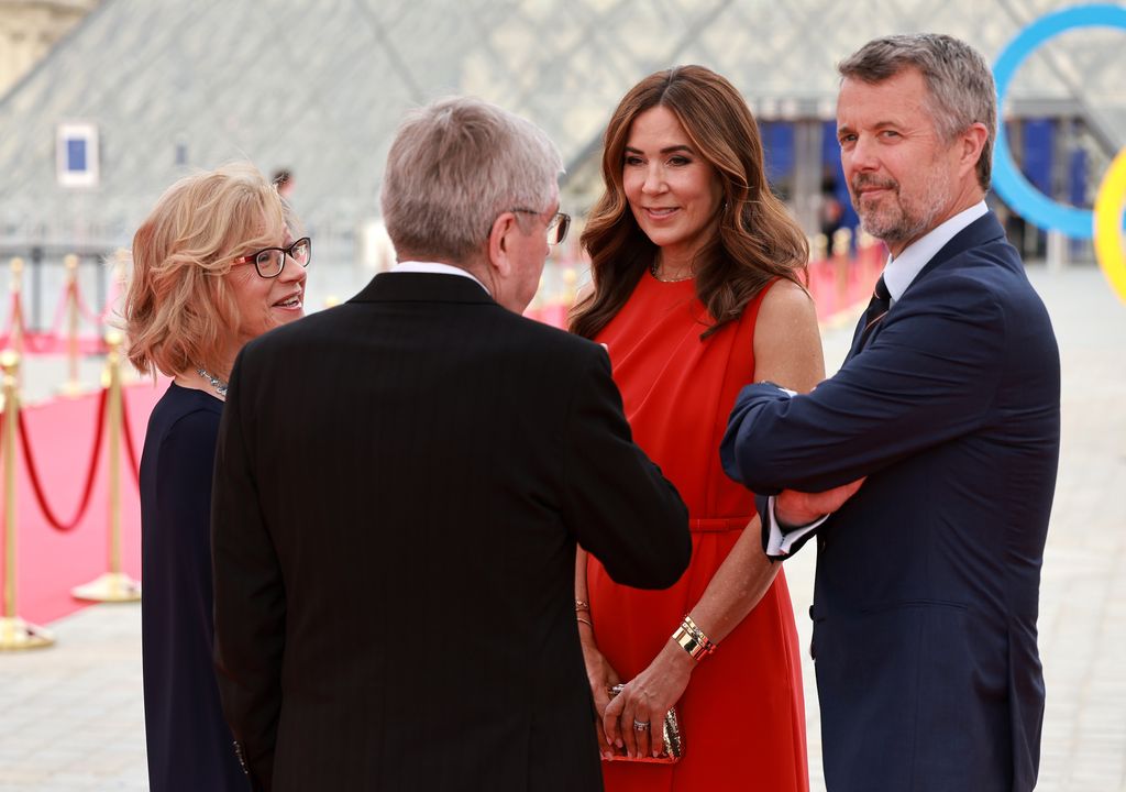 International Olympic Committee (IOC) President Thomas Bach (2nd L) and his wife Claudia Bach (1st L) greet Danish King Frederik X (1st R) and Queen Mary as they attend the IOC & Elysee Dinner at the Louvre in Paris, France, on July 25, 2024