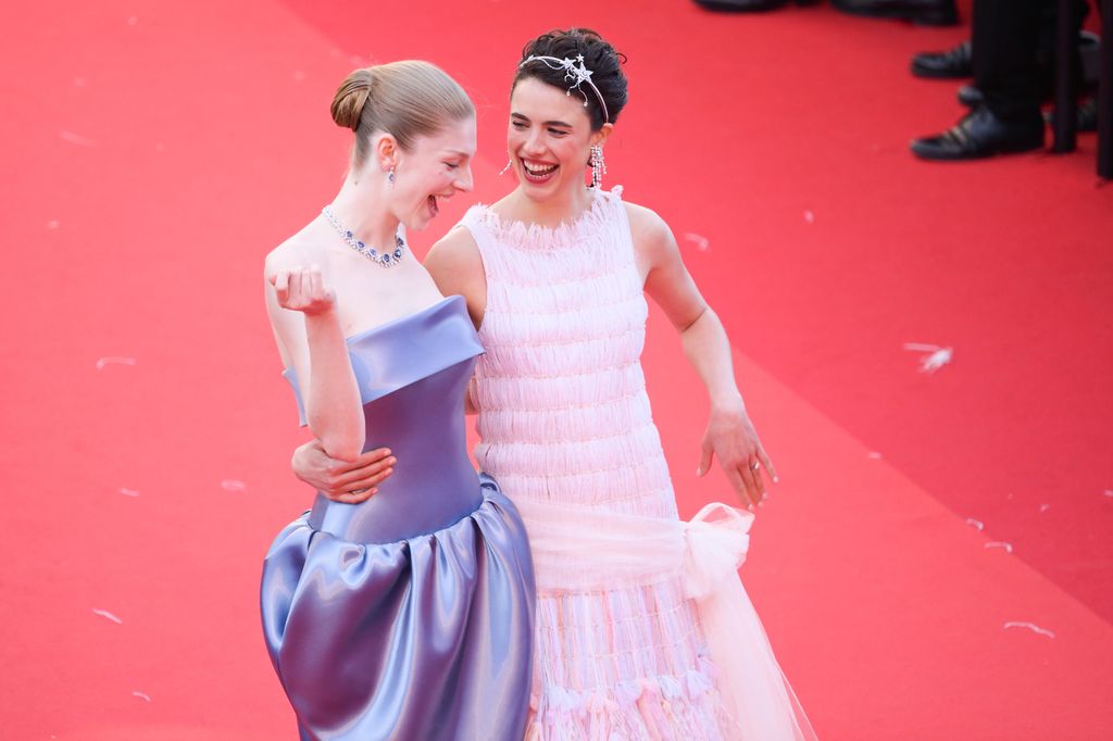 Hunter Schafer and Margaret Qualley attend the "Kinds Of Kindness" Red Carpet at the 77th annual Cannes Film Festival at Palais des Festivals on May 17, 2024 in Cannes, France. (Photo by Stephane Cardinale - Corbis/Corbis via Getty Images)