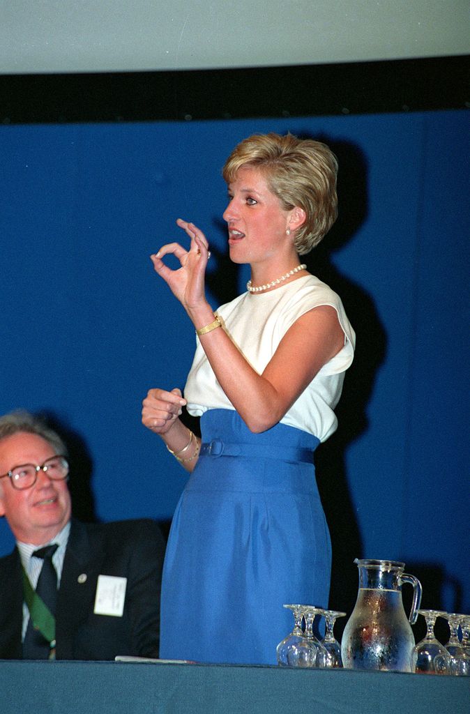 Princess Diana showing her skills at using sign language