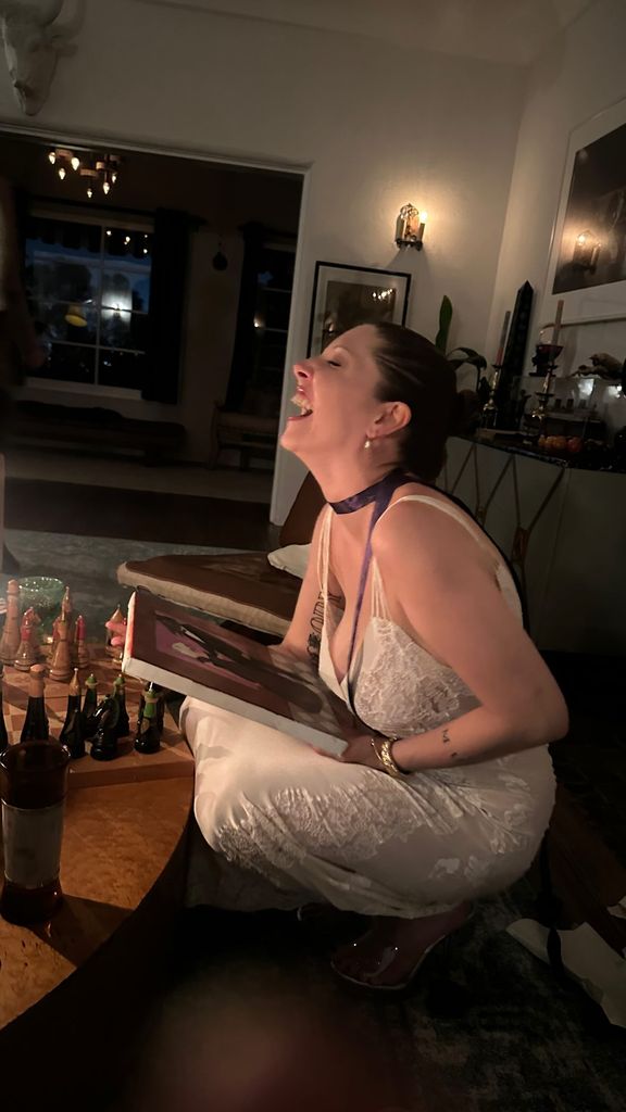 Georgia Ford captured mid-laughter holding a painting at home on her birthday, shared on Instagram Stories
