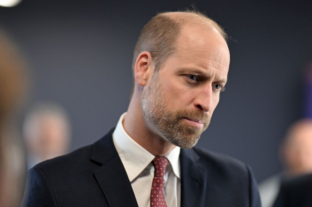 Prince William in suit looking pensive